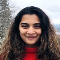 Smiling young woman with long dark hair